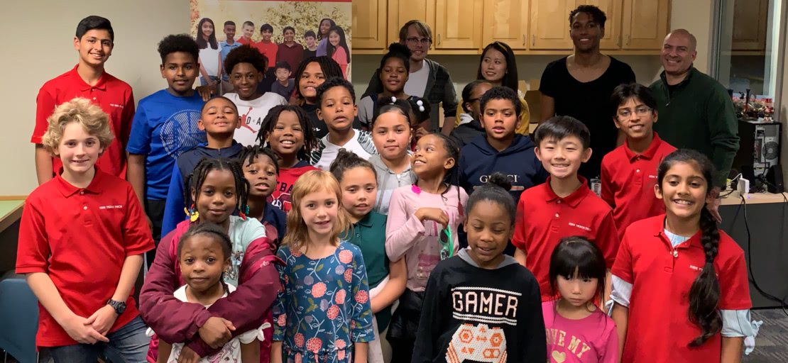 Slide Image - students and team posing for picture